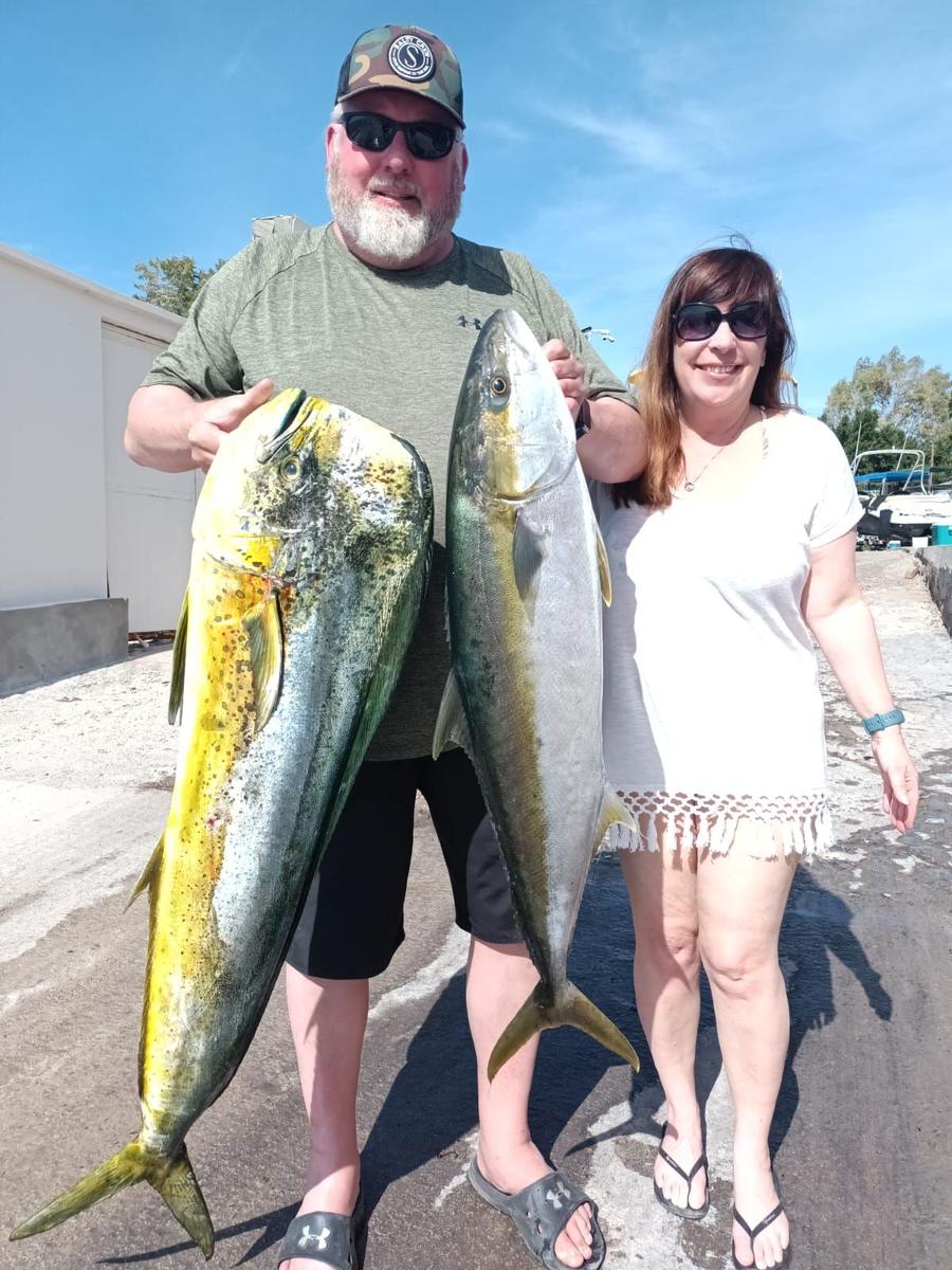 Couple at the dock with dorado and yellowtail in La Paz